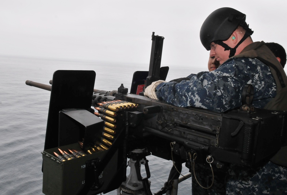 Midshipmen fire .50-caliber machine gun