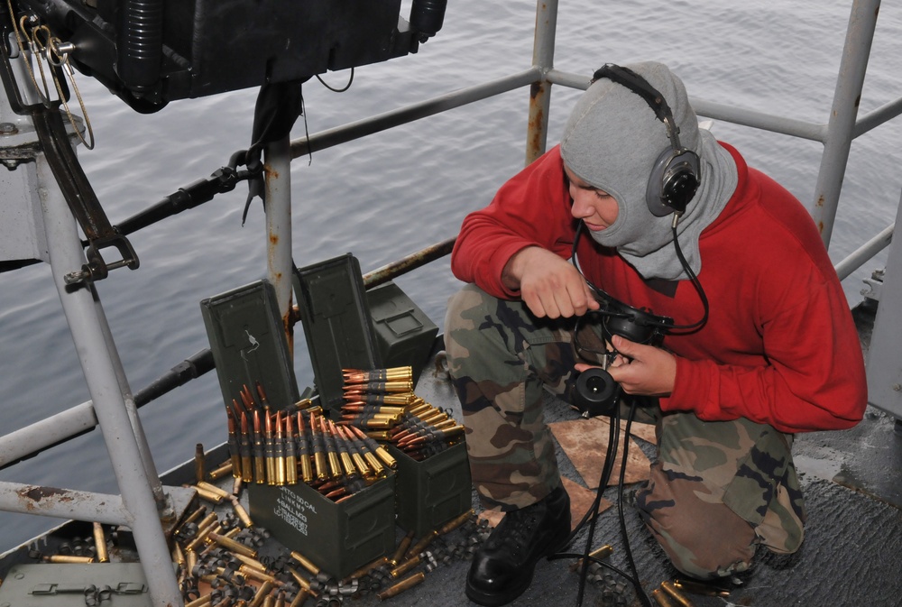 Midshipmen fire .50-caliber machine gun