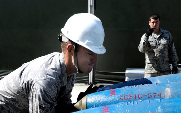 Munitions crew chiefs handle BDUs