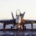 Perform maintenance on an F/A-18E Super Hornet