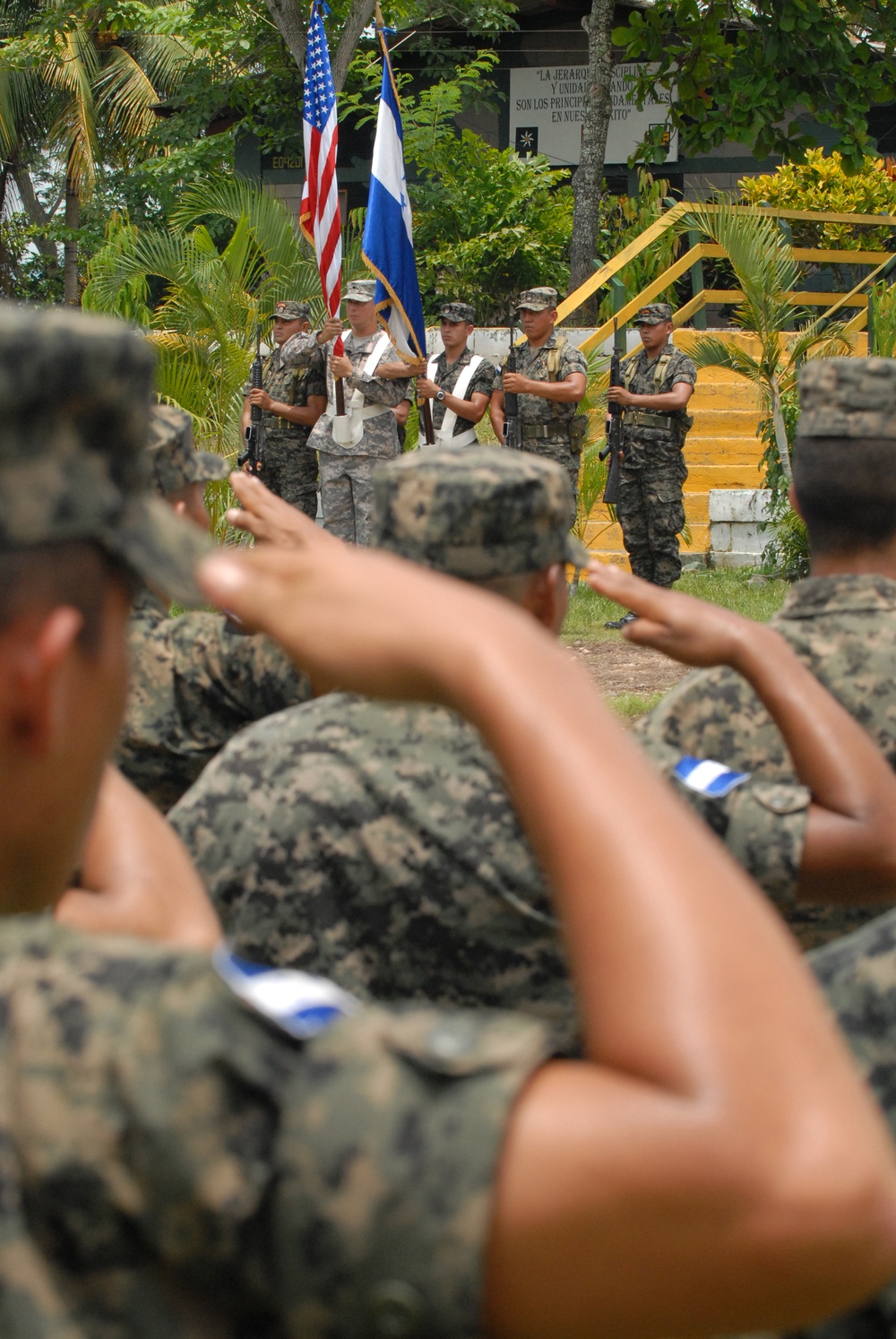 Honduran soldiers salutes during Honduran national anthem