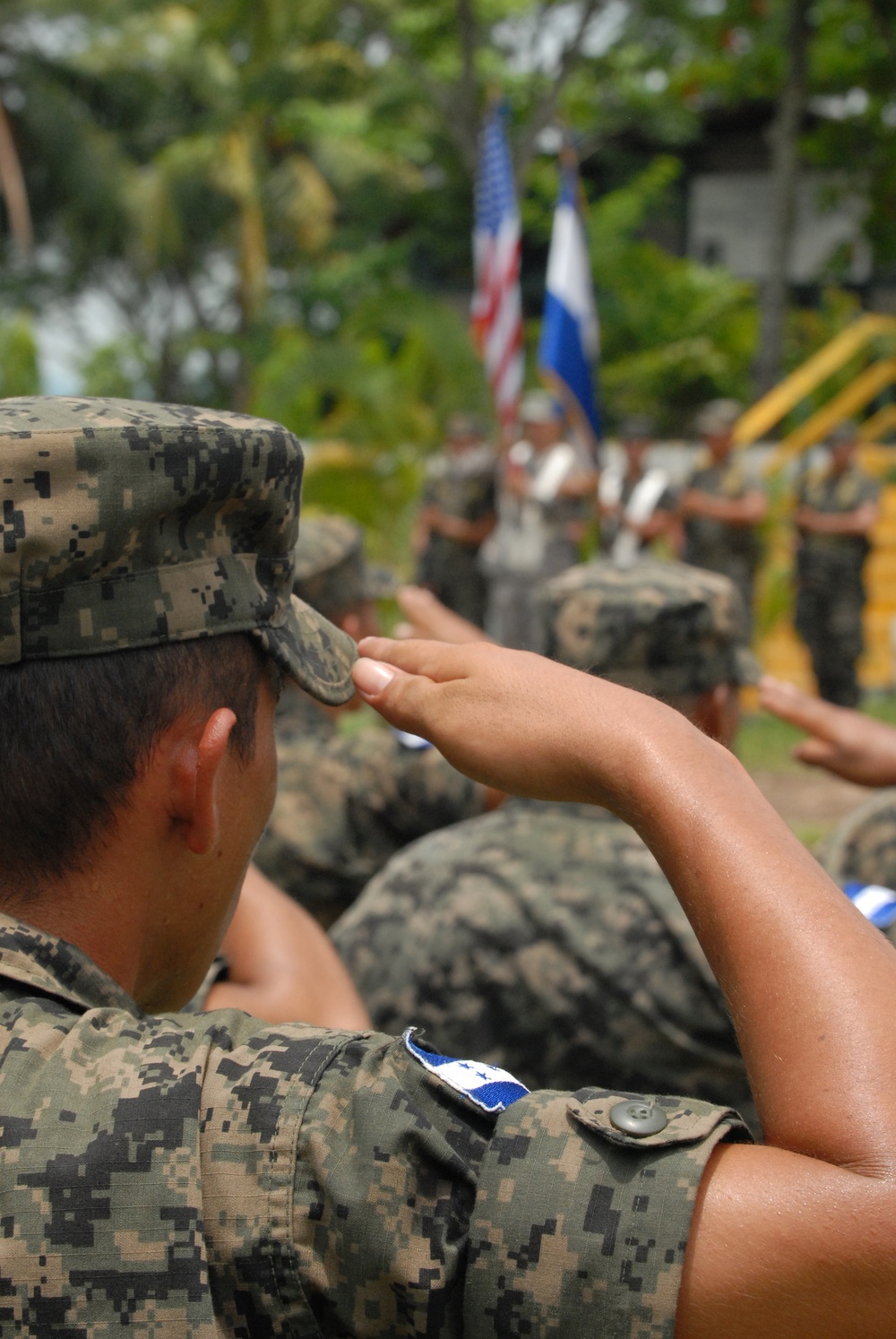 Honduran soldier salutes during BTH-Honduras 2012 Closing Ceremony