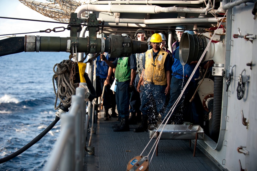 USS Cowpens sailors during replenishment at sea