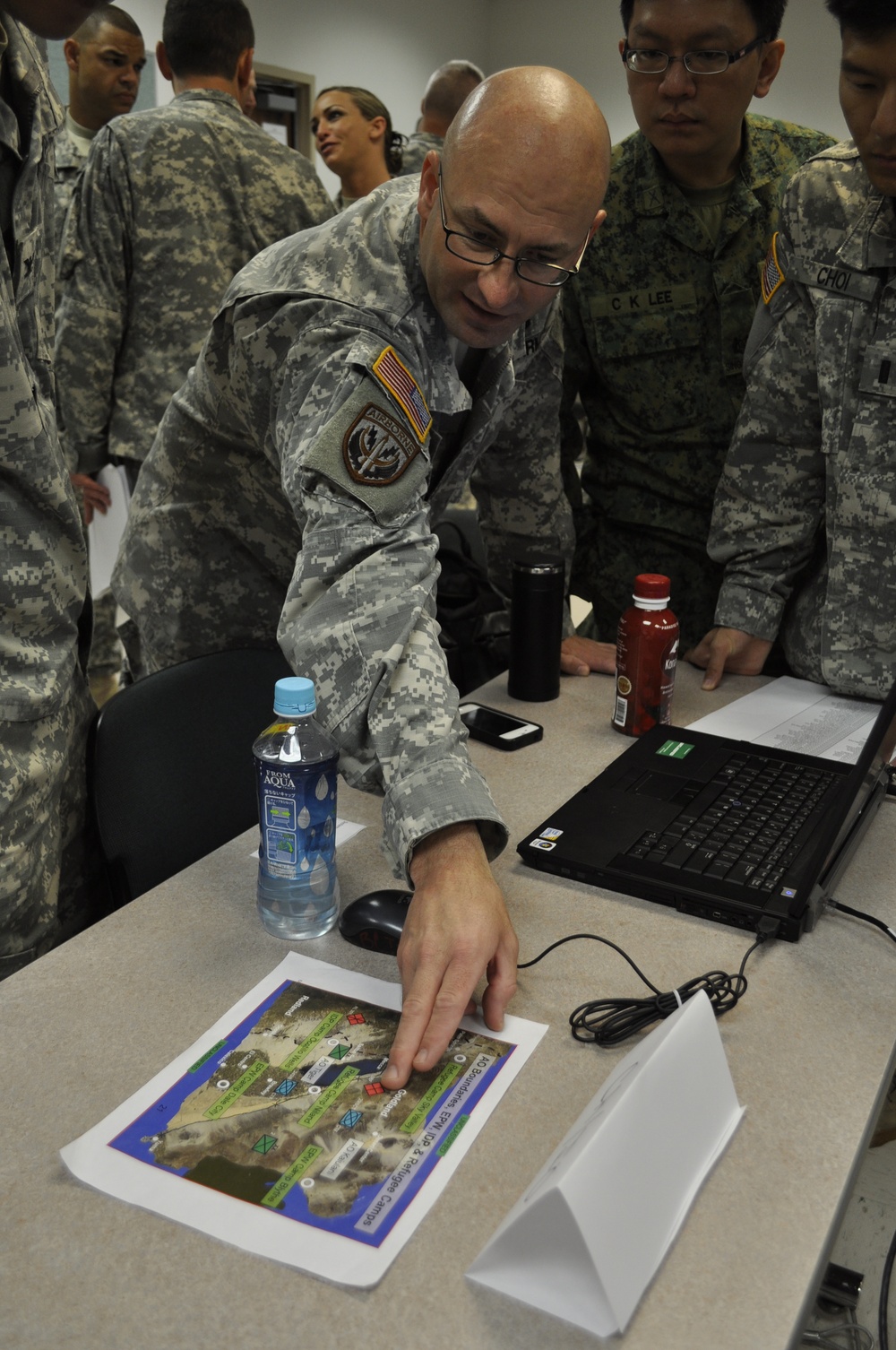 Staff Sgt. Burton explains map info during Tiger Balm