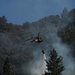 California Army National Guard helicopter drops water on Robbers Fire