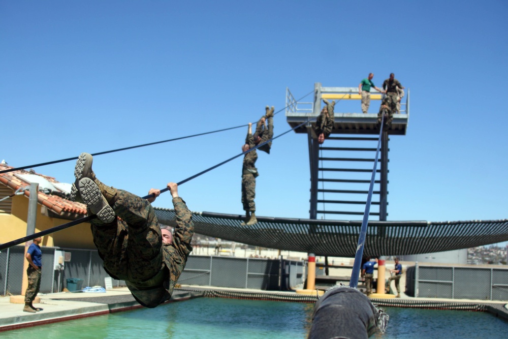 Co. L recruits attack high obstacles at Confidence Course