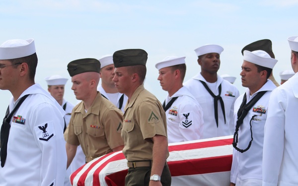 USS Fort McHenry conduct a burial at sea ceremony
