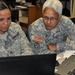 Members from the 29th Brigade Support work on computer simulations