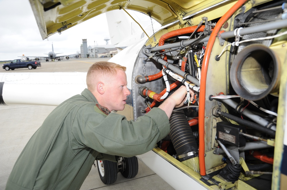 NAF Misawa crew members conduct pre-flight inspection on UC-12F Huron