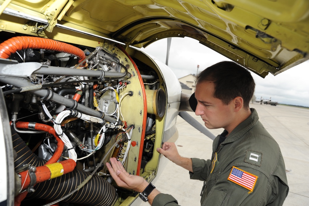 NAF Misawa crew members conduct pre-flight inspection on UC-12F Huron
