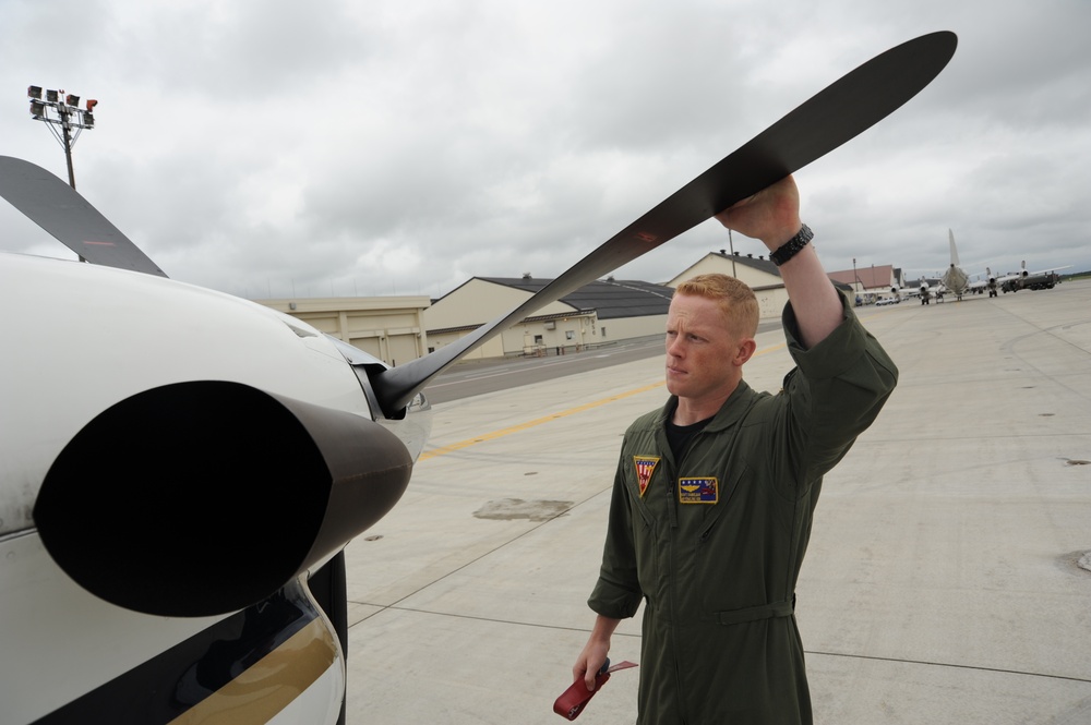 NAF Misawa crew members conduct pre-flight inspection on UC-12F Huron