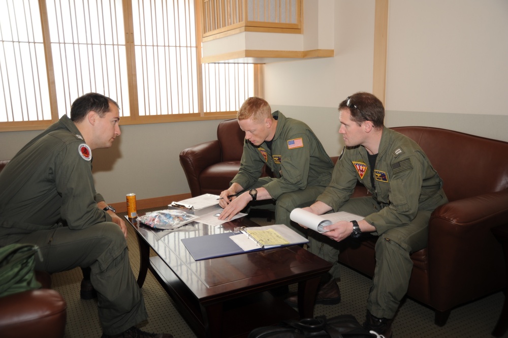 NAF Misawa crew members conduct pre-flight inspection on UC-12F Huron
