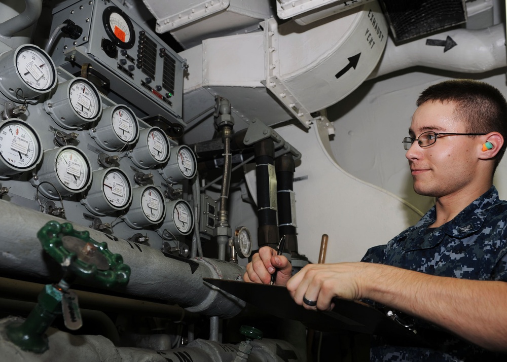 USS Nimitz sailor at work