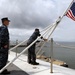 USS George H.W. Bush sailors lower flag in remembrance of shooting victims
