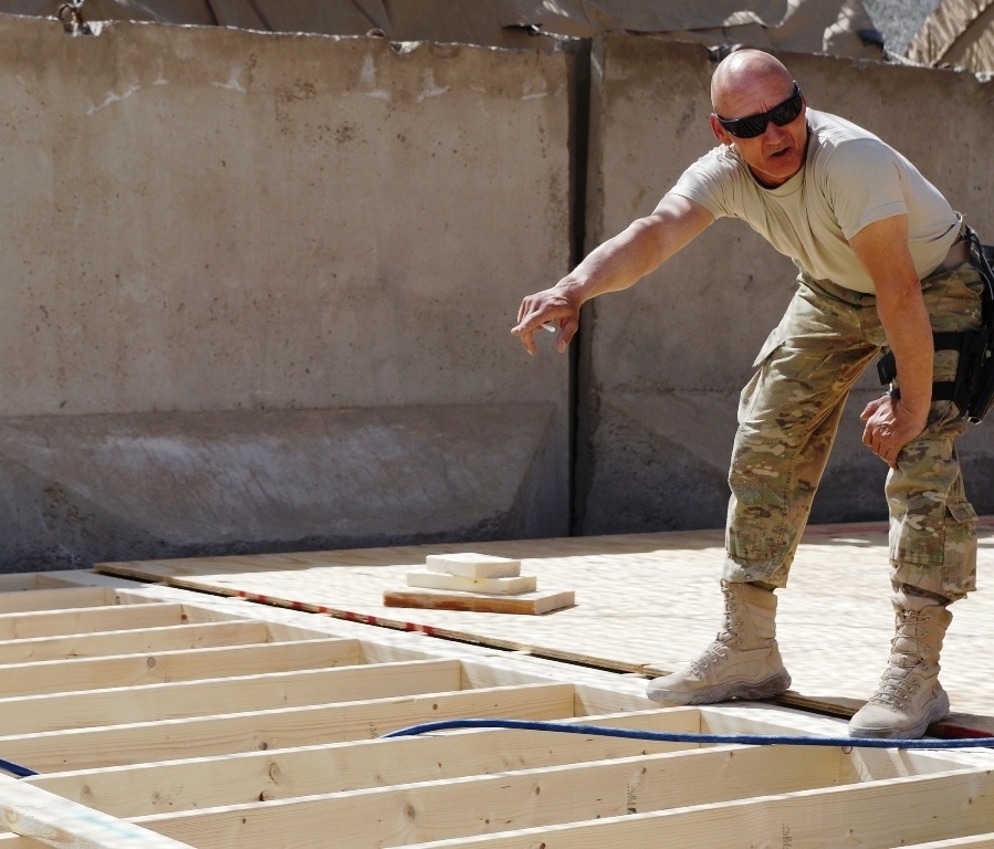 Kentucky soldier helps lay flooring in a new building