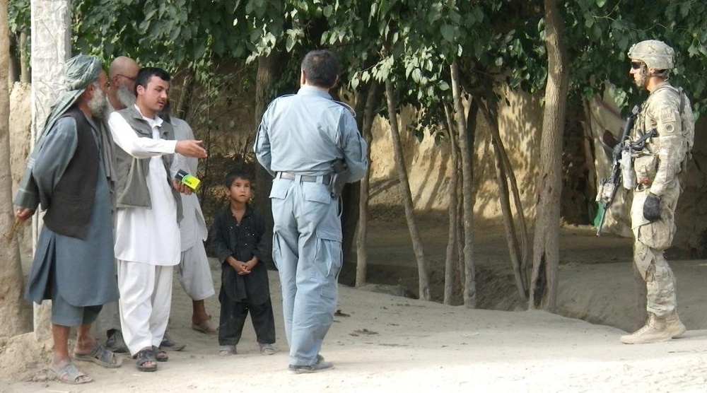 Team Rock distributes radios to Afghans