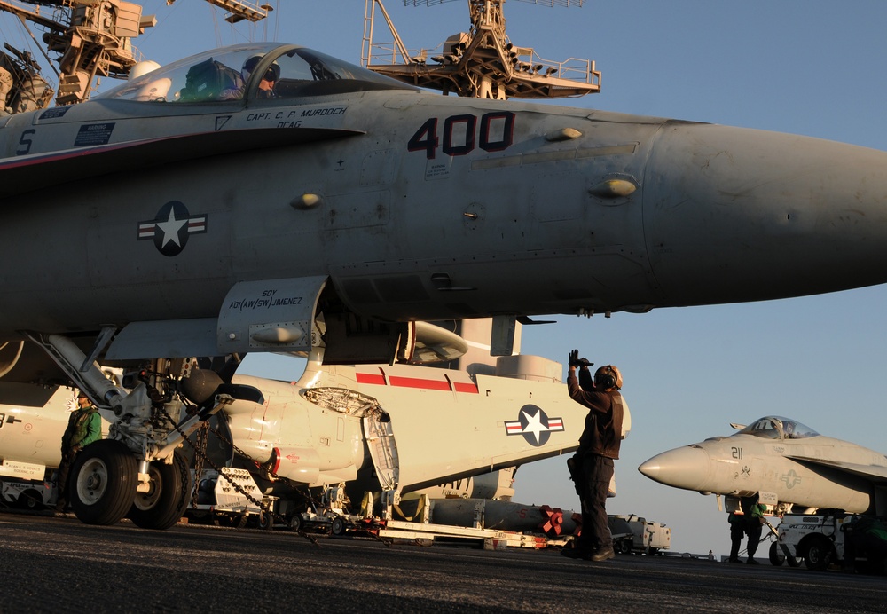 Inspecting the inside of an F/A-18C Hornet