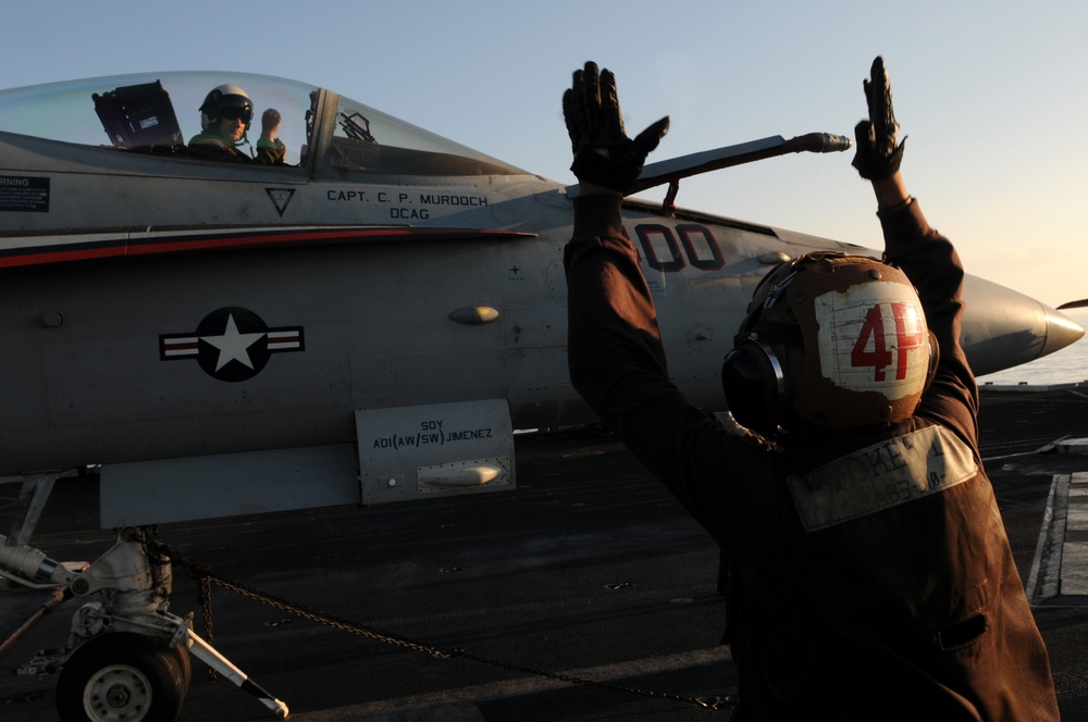 Plane captain signals to the pilot