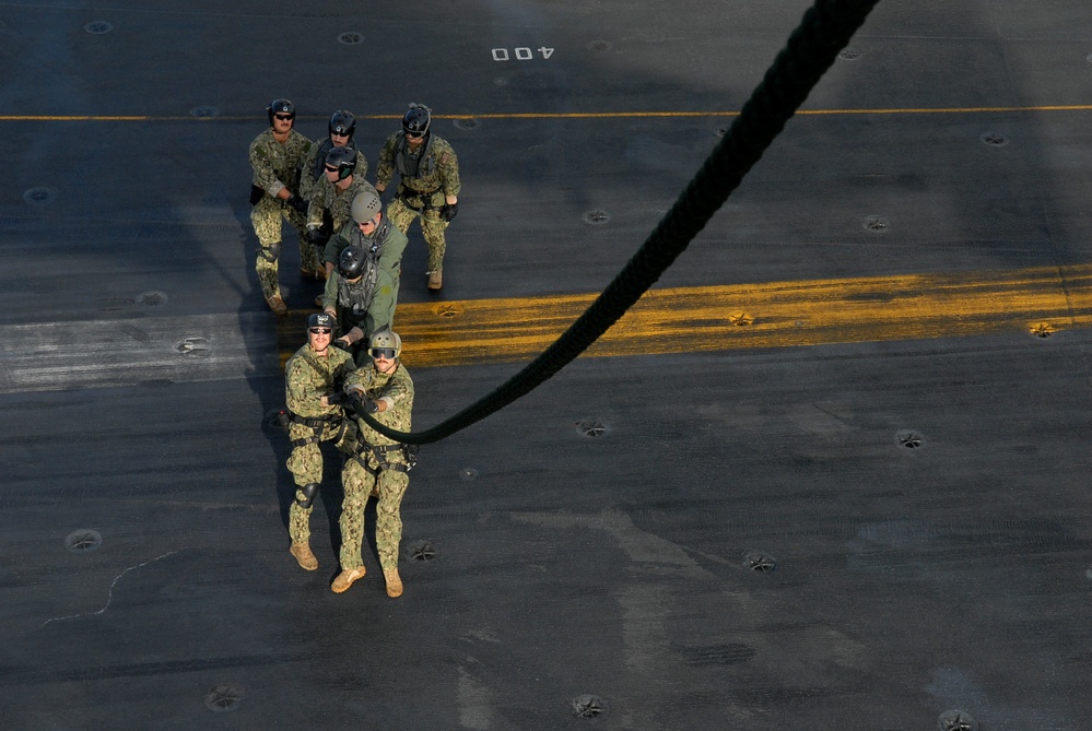 Conducting a fast rope and rappelling exercise
