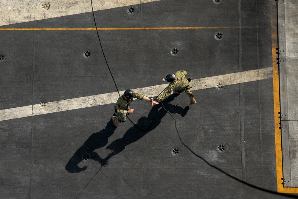 Conducting a fast rope and rappelling exercise