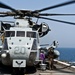 Refueling a Marine Corps CH-53E Super Stallion helicopter