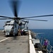 Refueling a Marine Corps CH-53E Super Stallion helicopter