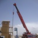 Crane moves security tower