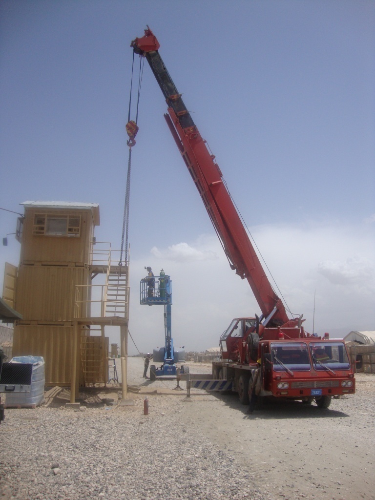 Crane moves security tower