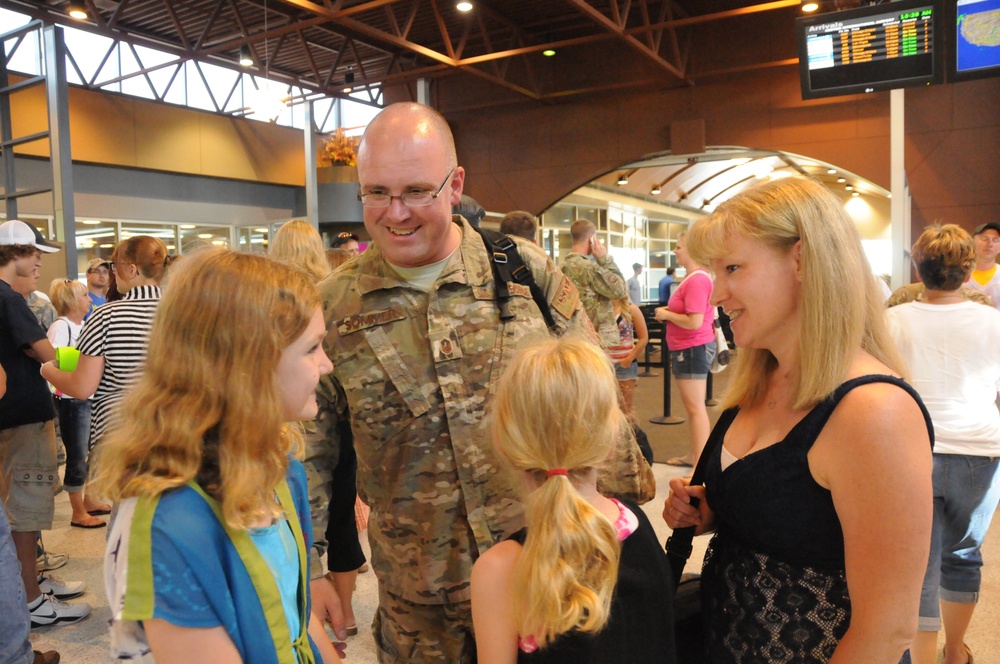 Airman greets family