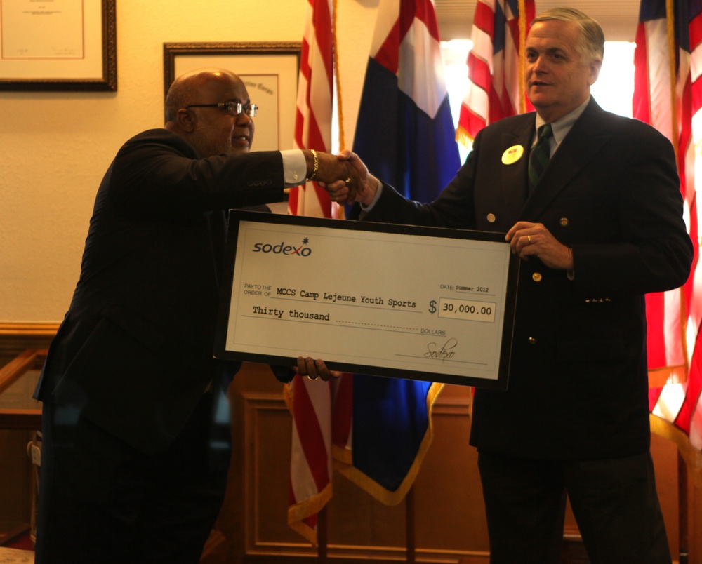 Sodexo, Inc. presents check to MCCS