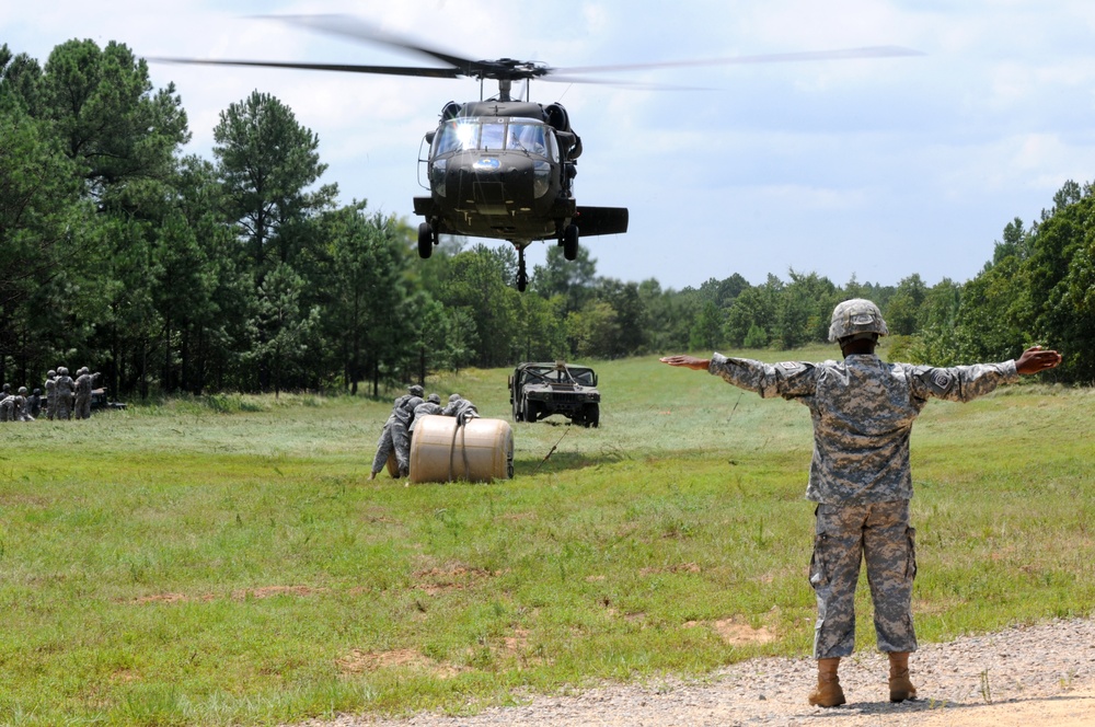 Support soldiers partner with National Guard for sling load training