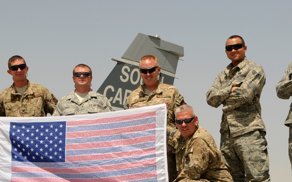 F-16 crew chiefs pose with a 9/11 flag