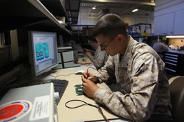 Radio technician repairs radio chip