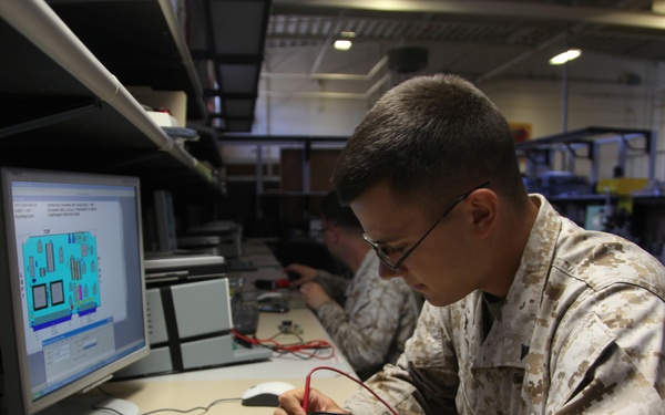 Radio technician repairs radio chip