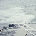 USS George Washington sailor dries flight deck