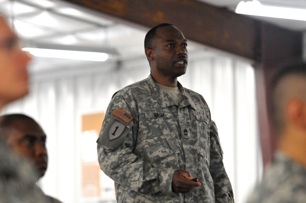 Jamaican native instructs troops on how to survive in an MRAP