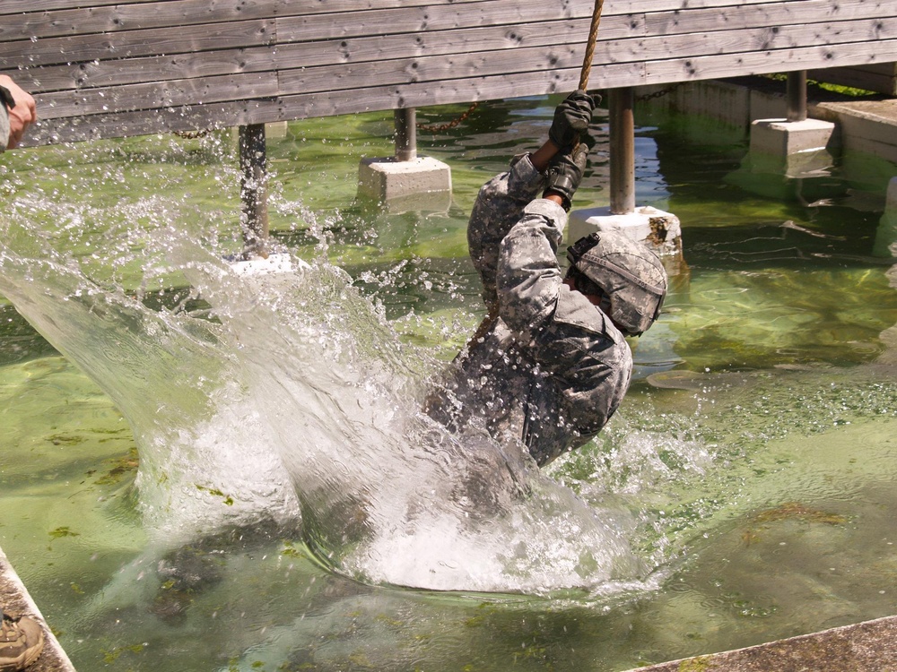 Soldiers of the 527th Military Police Company conduct a water crossing as part of a Leader Reactionary Training Course TSC Ansbach.