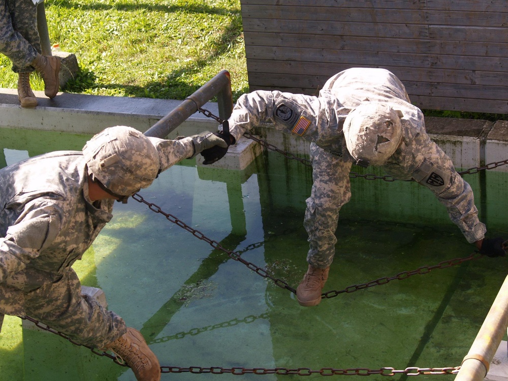 Soldiers of the 527th Military Police Company conduct a water crossing as part of a Leader Reactionary Training Course TSC Ansbach