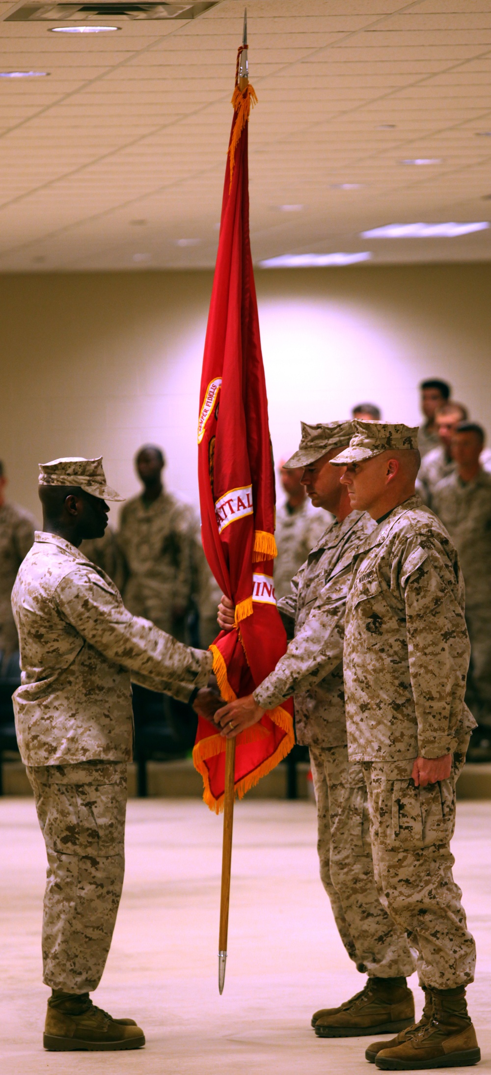 Sgt. Maj. O'Connor passes the unit guidon to the outgoing commanding officer of MCTBn