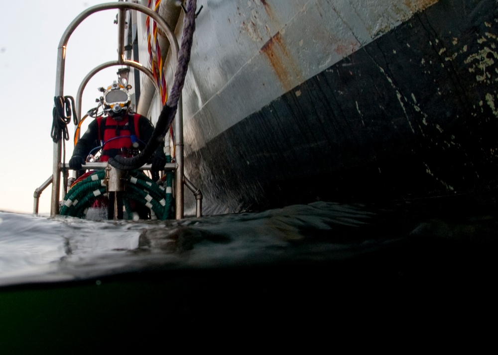 US Navy divers search for the remains of 5 un-accounted for service members from 1942