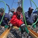 US Navy divers search for the remains of 5 un-accounted for service members from 1942