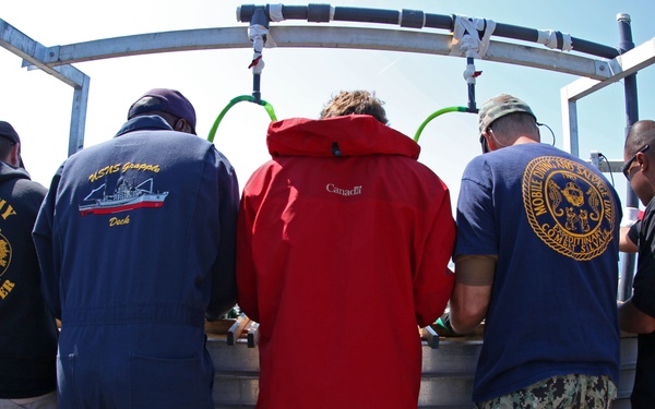 US Navy divers search for the remains of 5 un-accounted for service members from 1942