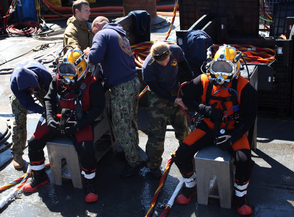 US Navy divers search for the remains of 5 un-accounted for service members from 1942