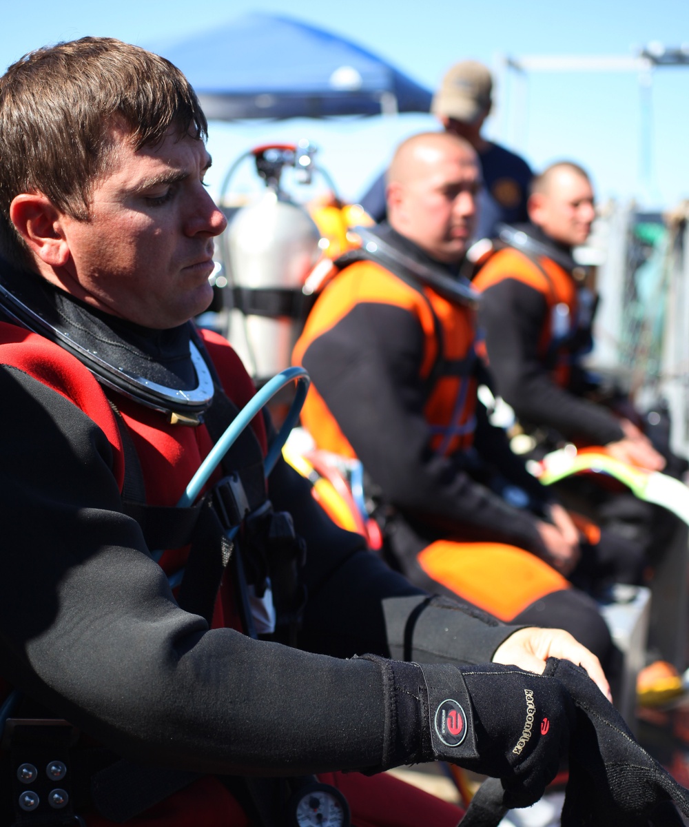 US Navy divers search for the remains of 5 un-accounted for service members from 1942