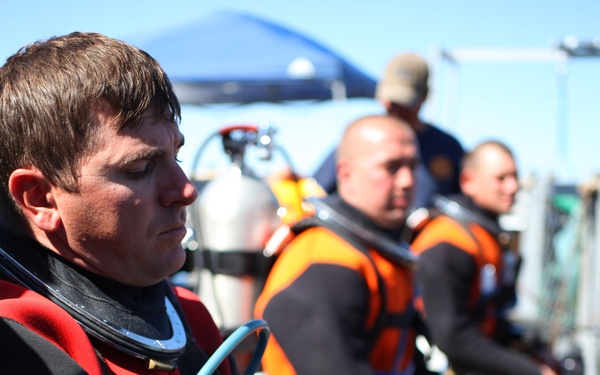 US Navy divers search for the remains of 5 un-accounted for service members from 1942