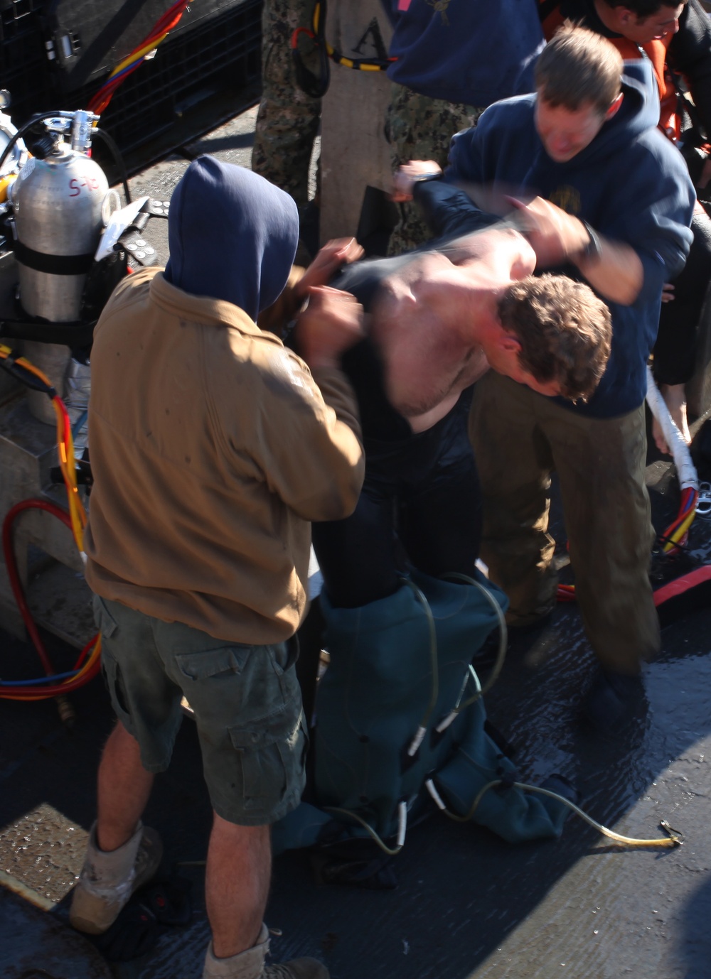 US Navy divers search for the remains of 5 un-accounted for service members from 1942