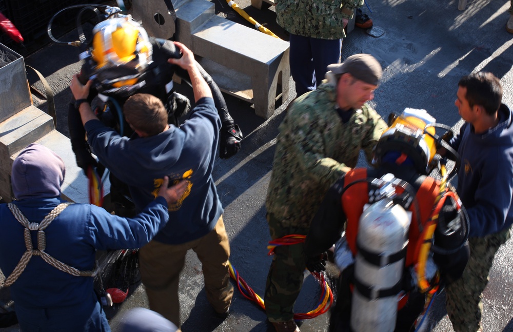 US Navy divers search for the remains of 5 un-accounted for service members from 1942