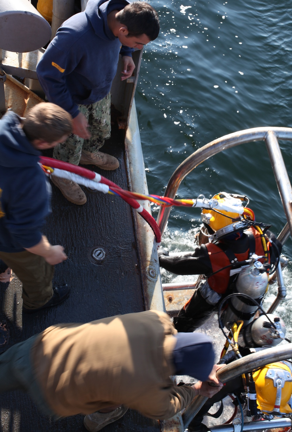 US Navy divers search for the remains of five un-accounted for service members from 1942