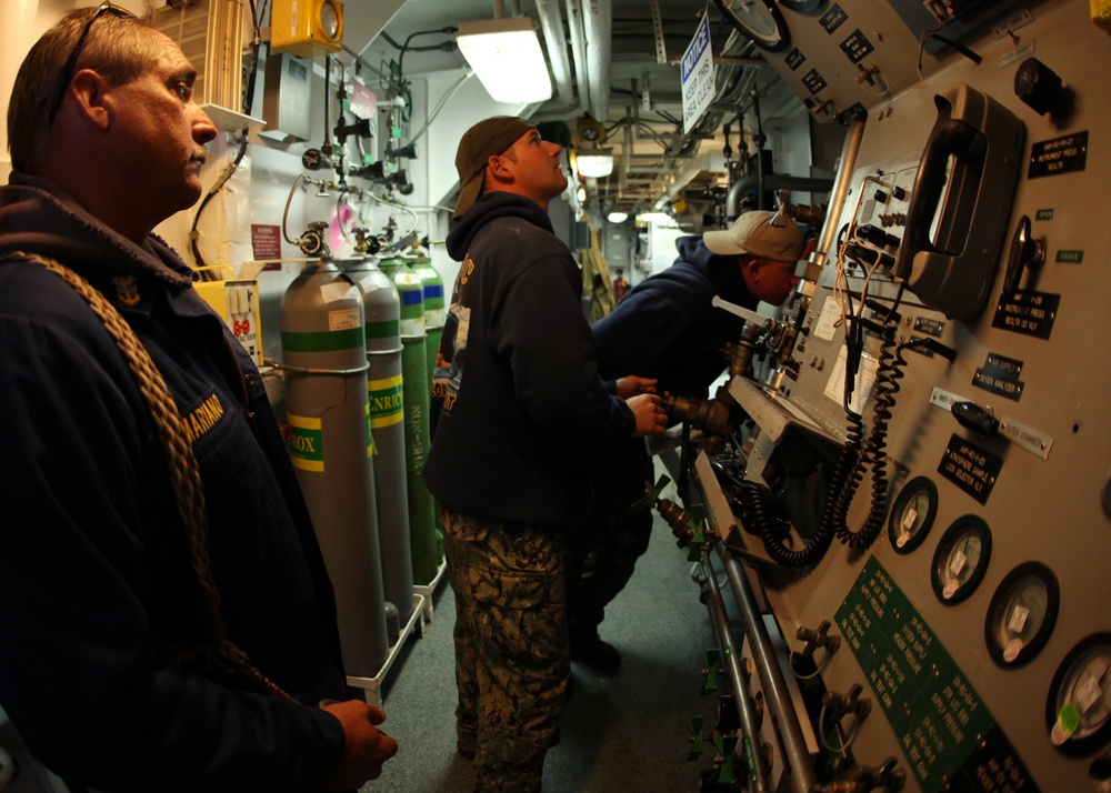 US Navy divers search for the remains of 5 un-accounted for service members from 1942