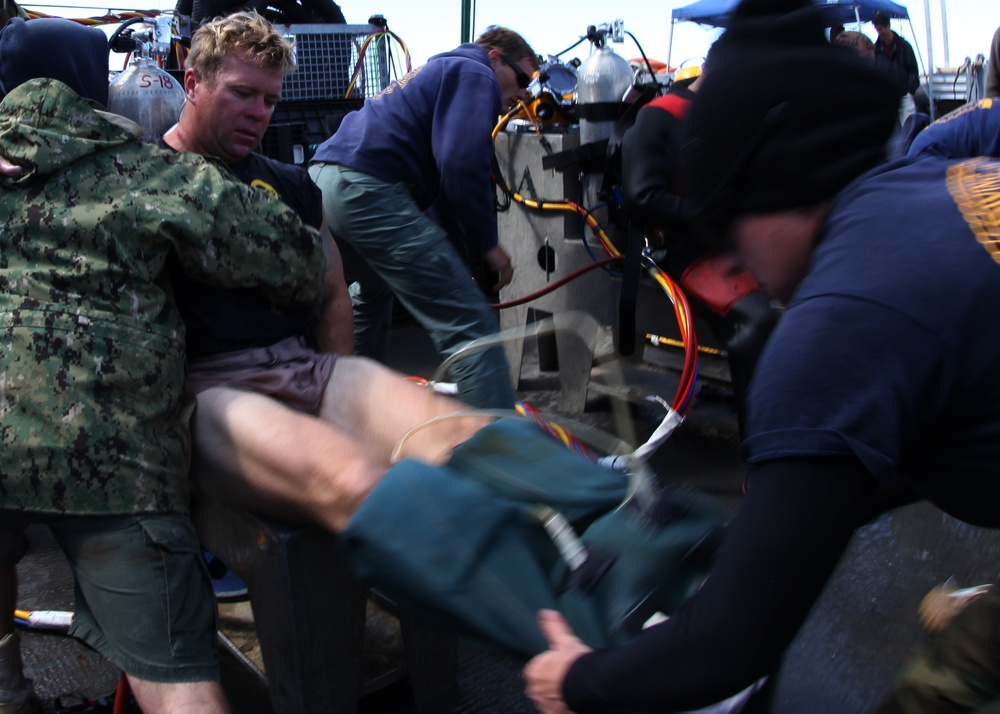 US Navy divers search for the remains of 5 un-accounted for service members from 1942